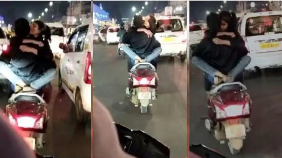 Video: ચાલતા મોપેડ પર કિસ કરતા હતા છોકરો-છોકરી, પોલીસે ભણાવ્યો પાઠ