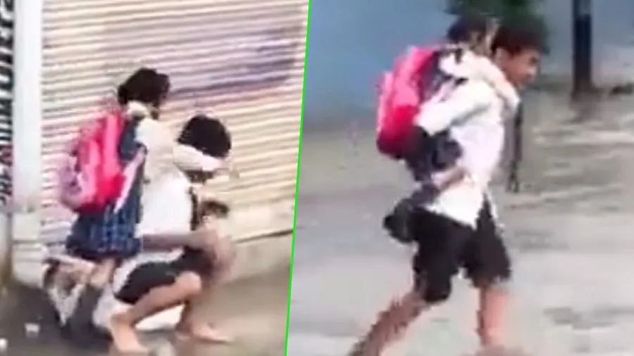 રસ્તા પર પાણી ભરાતા નાની બહેનને પીઠ પર બેસાડીને ચાલવા લાગ્યો ભાઈ, જુઓ વીડિયો